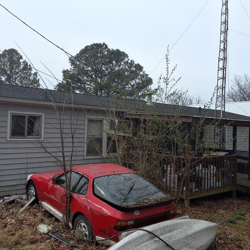 Abandoned red car with extensive body damage