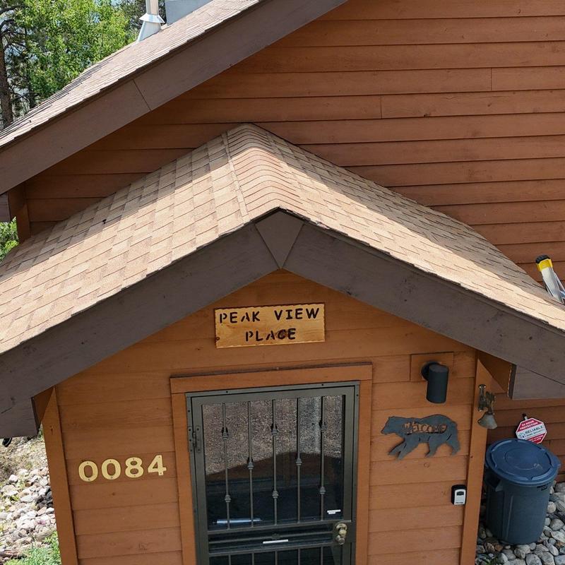 Asphalt shingle roof on rustic home exterior Asphalt shingle roof on rustic home exterior