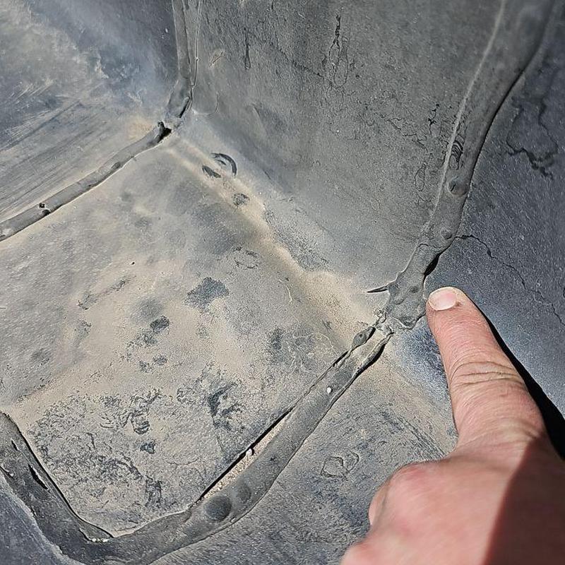 EPDM flat roof seam with cracks and damage EPDM flat roof seam with cracks and damage