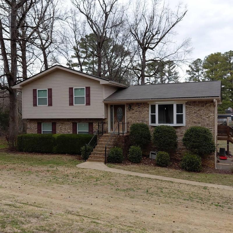 Asphalt shingle roof with box vents on residential home Asphalt shingle roof with box vents on residential home