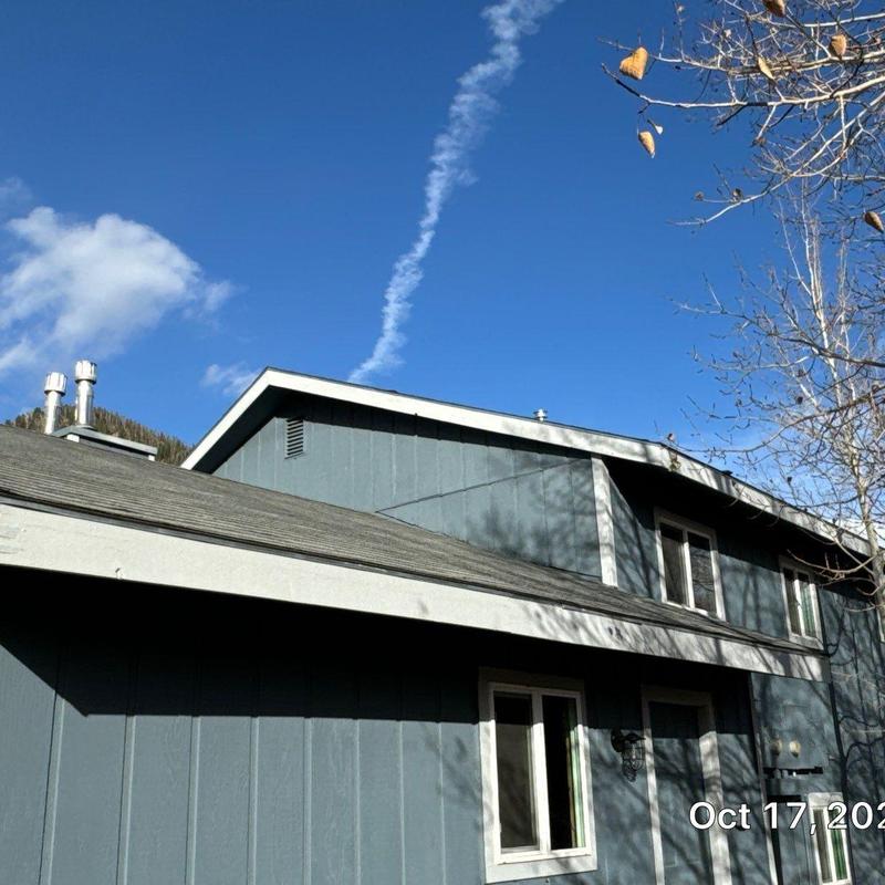 Asphalt shingle roof with weathered gray shingles Asphalt shingle roof with weathered gray shingles