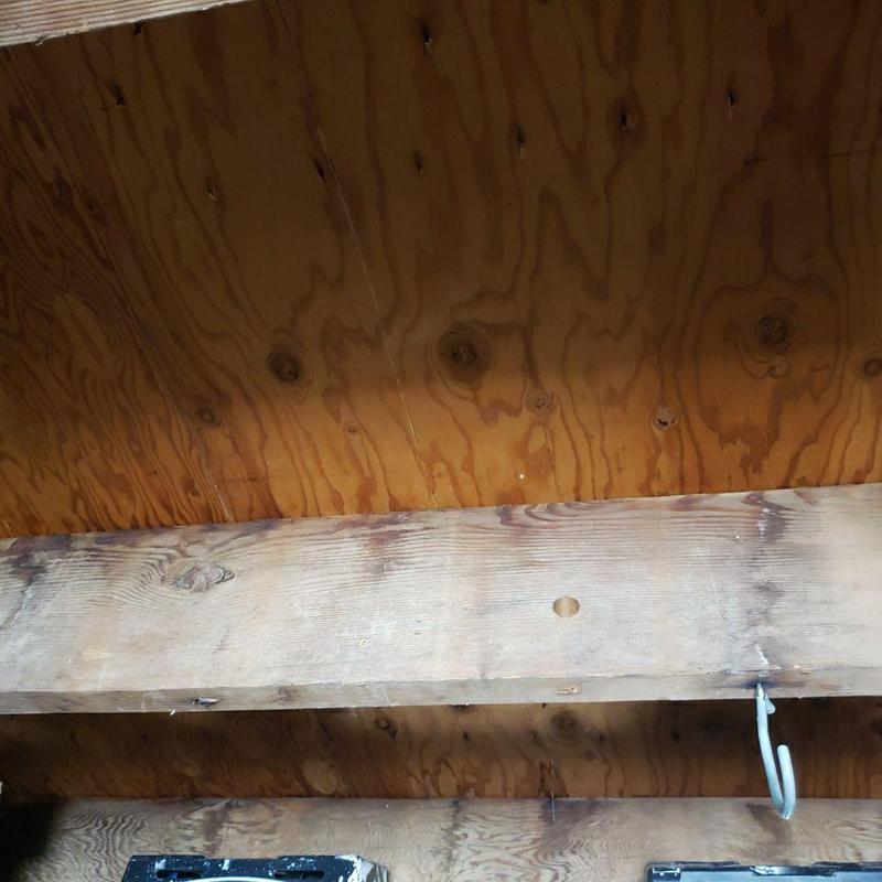 Wooden ceiling joists and plywood sheathing interior view Wooden ceiling joists and plywood sheathing interior view