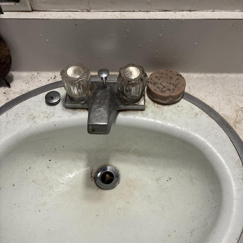Basin faucet with clear knobs and metal spout