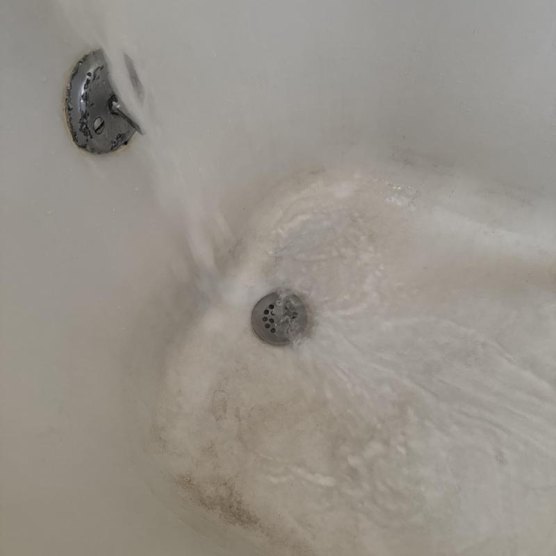 Bathtub drain with running water testing proper flow