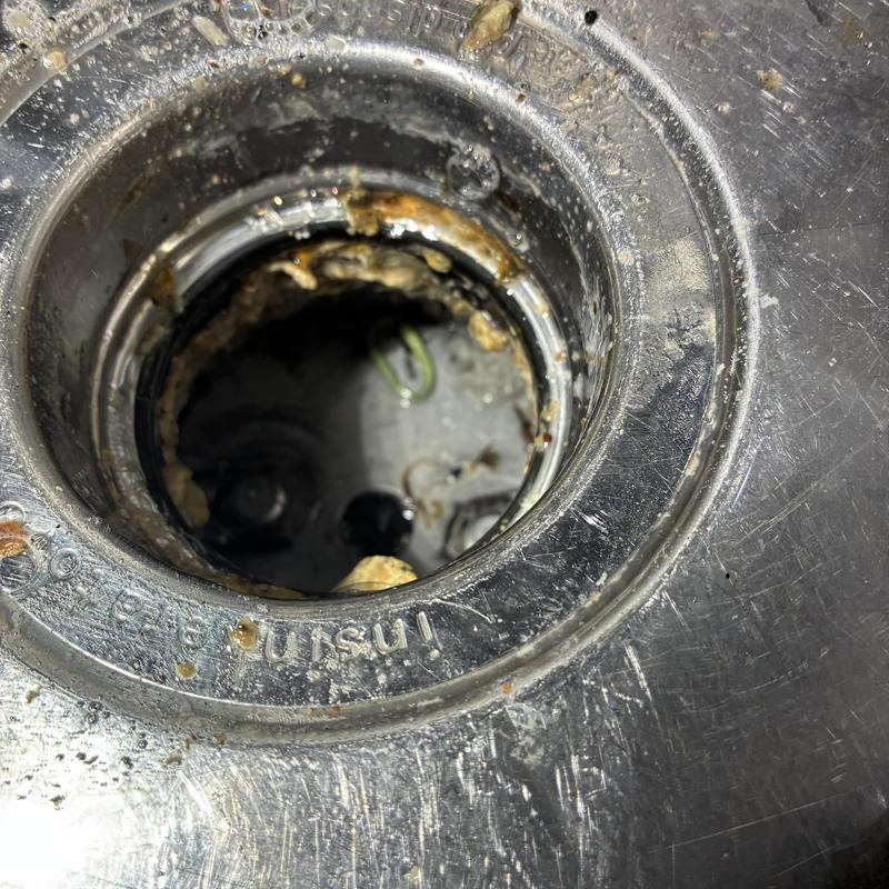 Garbage disposal reset with Allen wrench inside sink drain