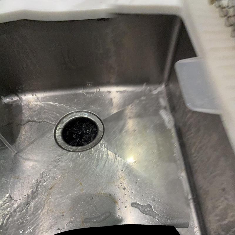 Garbage disposal reset with Allen wrench in kitchen sink