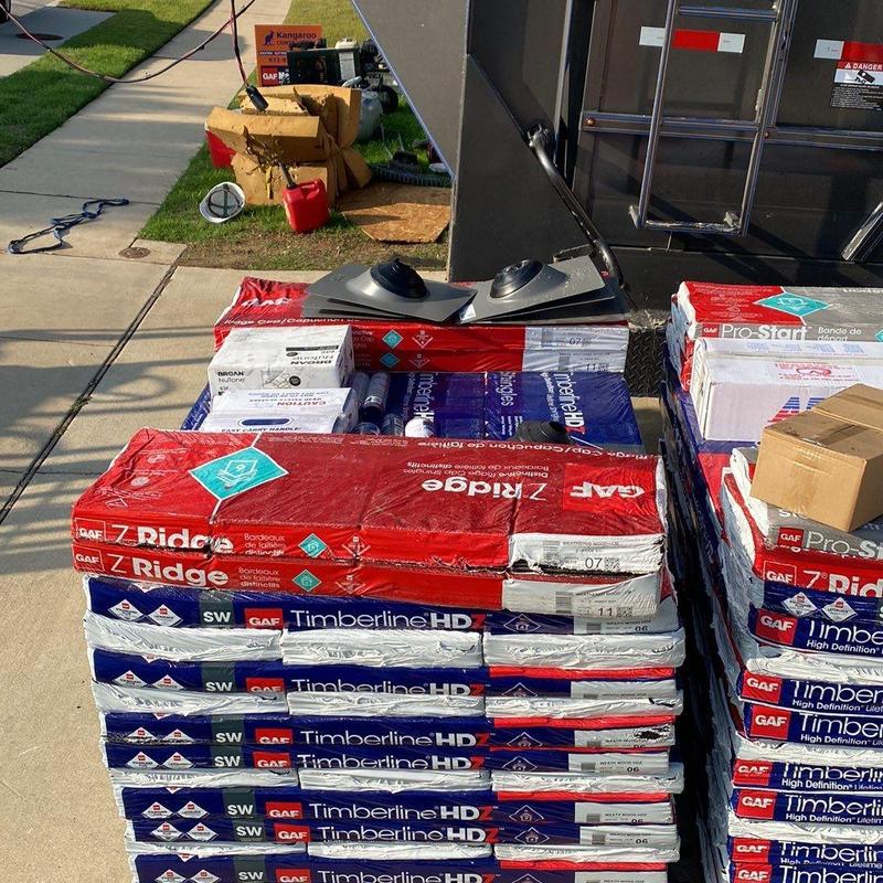 GAF Timberline HDZ roofing shingles stacked outdoors