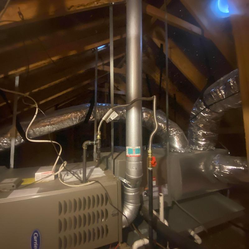 Furnace vent pipe and ductwork in attic space