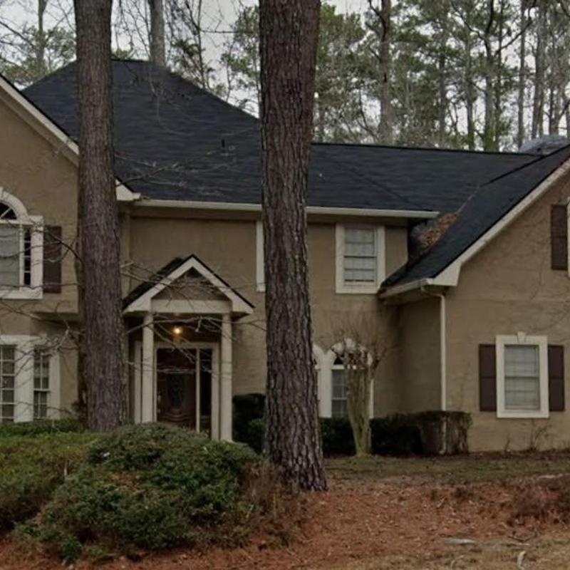 Asphalt roof replacement on two-story home exterior Asphalt roof replacement on two-story home exterior