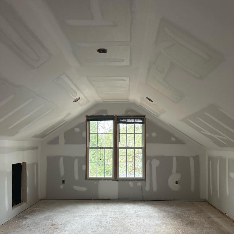 Drywall installation in attic office and living room space Drywall installation in attic office and living room space