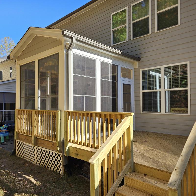 Three season room with wood deck and stairs Three season room with wood deck and stairs