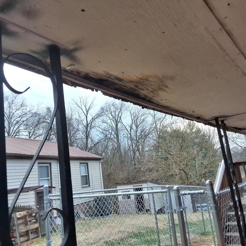 Garage soffit with water damage and staining