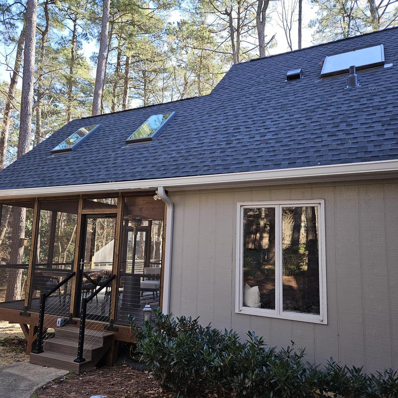 Screened porch with stairs and cable railing in backyard Screened porch with stairs and cable railing in backyard