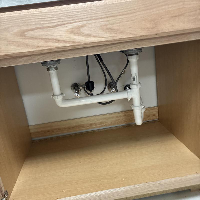 Kitchen sink PVC drain and water supply lines installation