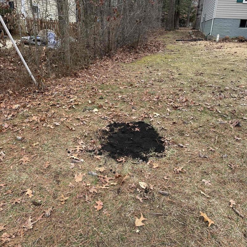 Underground pipe joint soil patch in yard Underground pipe joint soil patch in yard