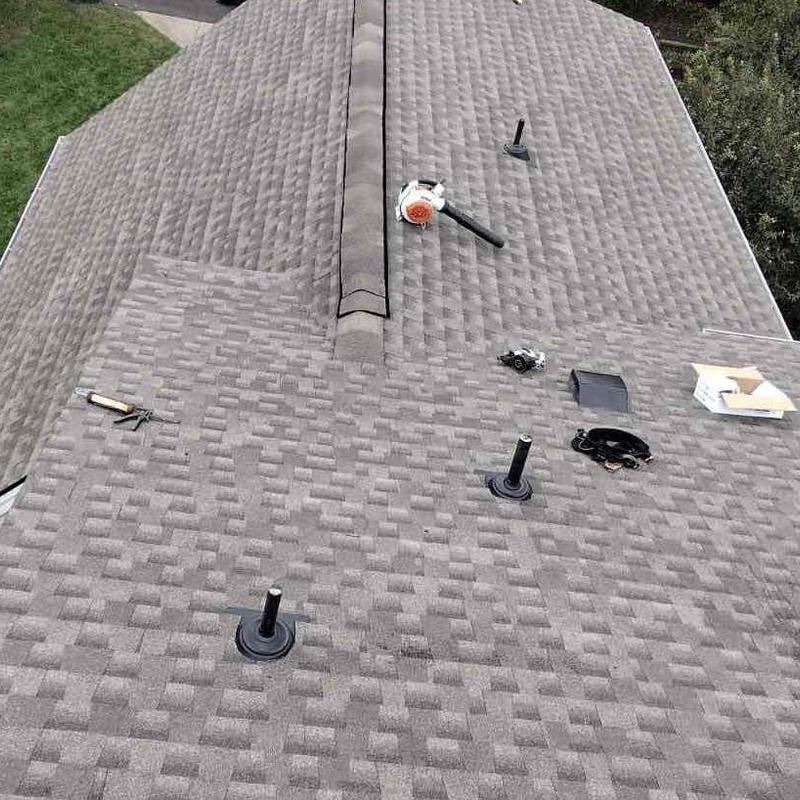 Asphalt shingle roof with ventilation pipe installations
