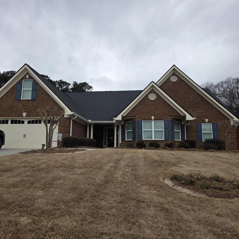 Roof valley with new flashing on brick house