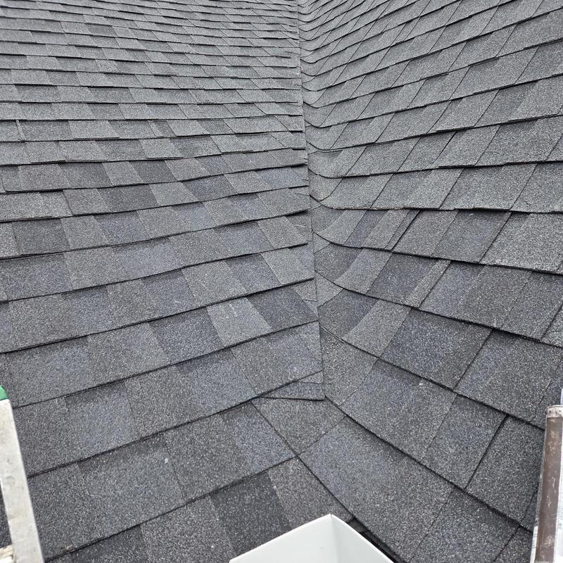 Roof valley with new asphalt shingles installation
