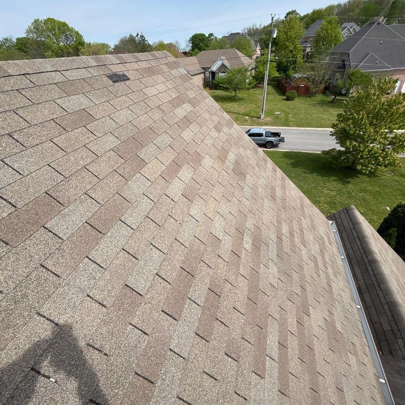 Asphalt shingle roof with hail damage inspection