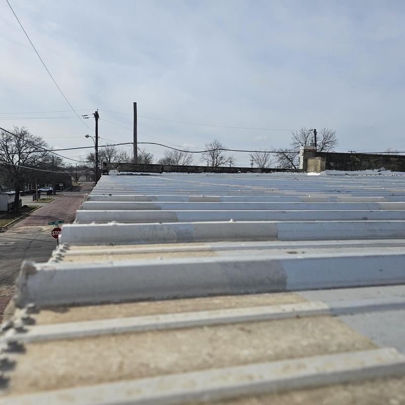 Metal roofing panels with hail damage in Terrell, TX