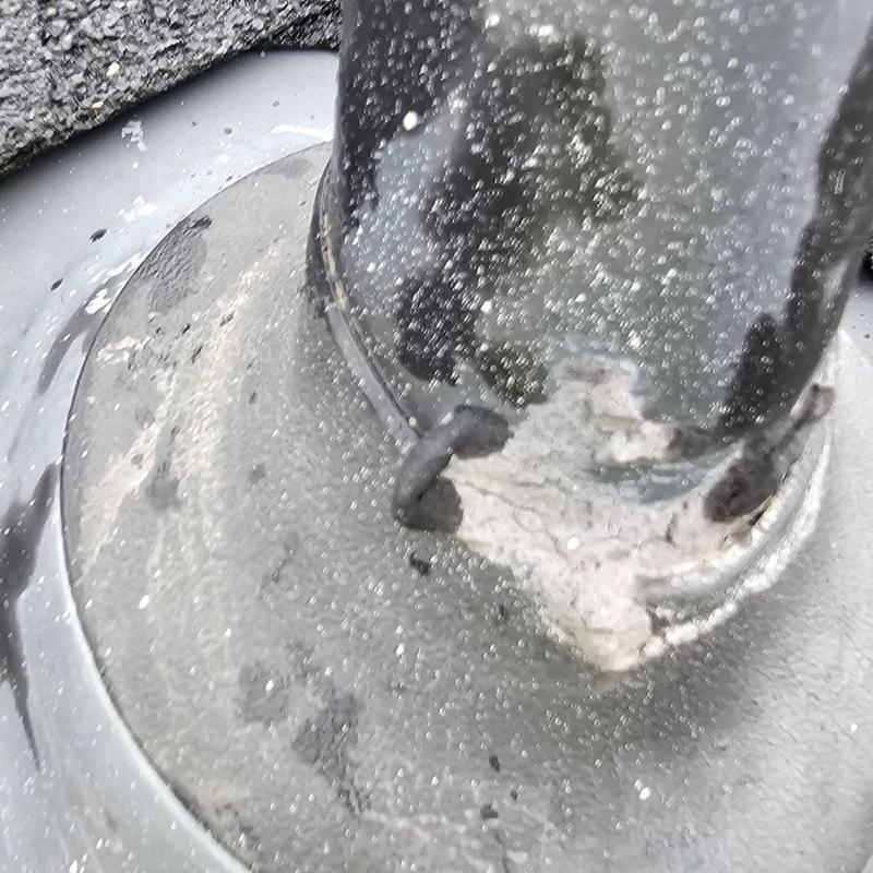 Roof pipe jack with deteriorated sealant close-up Roof pipe jack with deteriorated sealant close-up