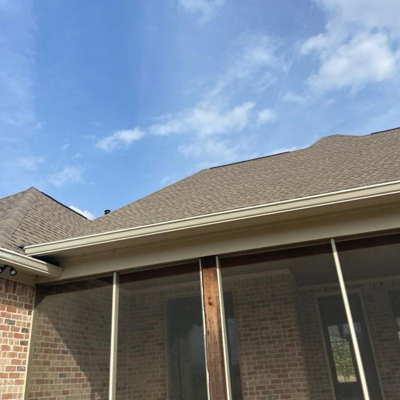 Asphalt shingle roof with gutter and screen porch panel