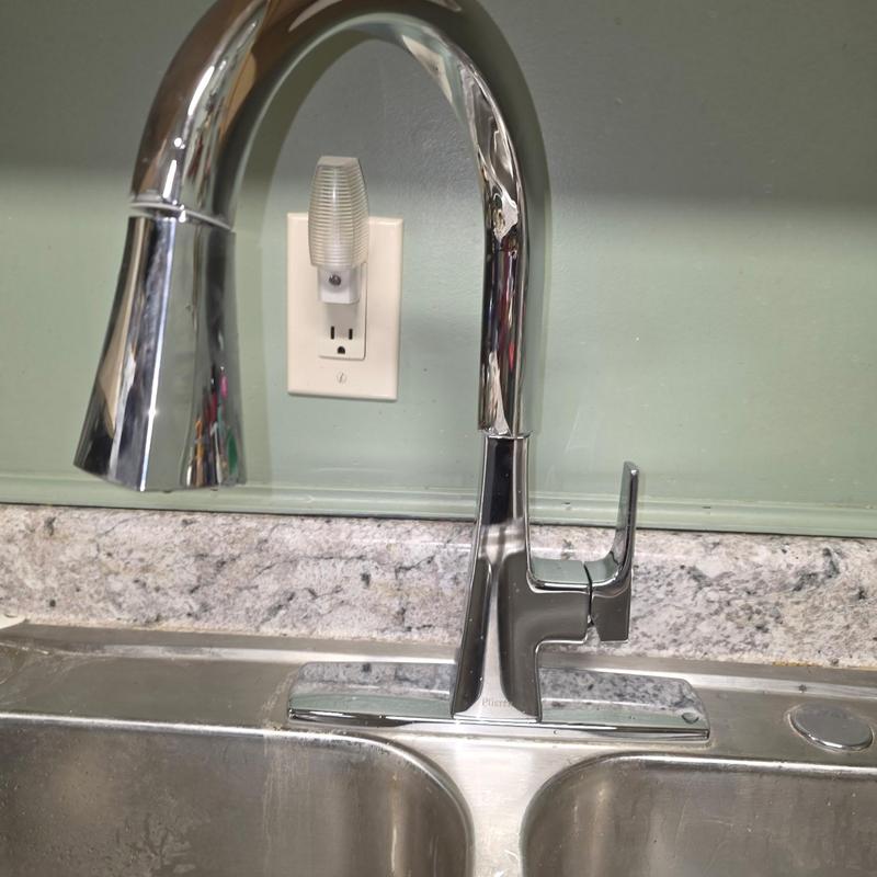 Kitchen faucet installation on double sink with granite