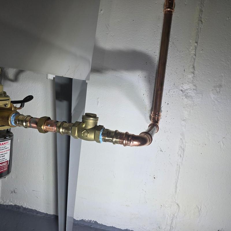 Laundry shellback lift pump and check valve installation