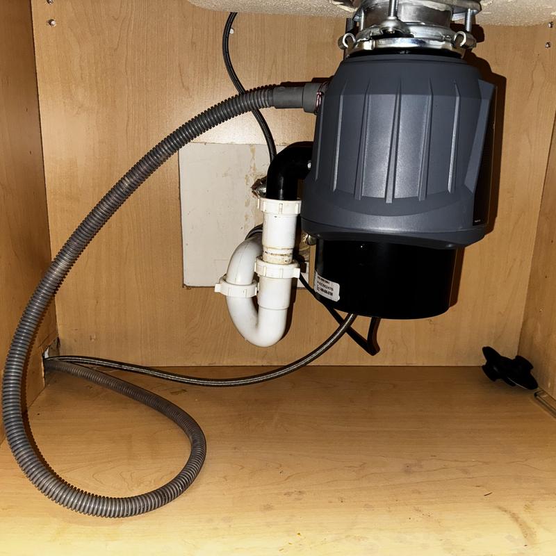 Garbage disposal installation under kitchen sink
