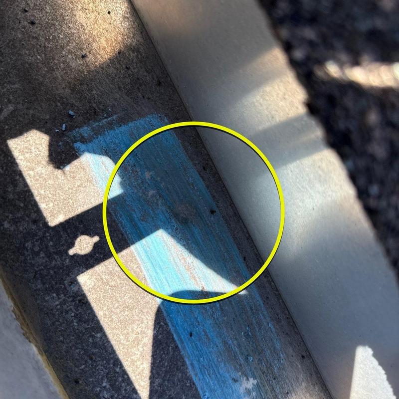 Roof drain channel with hail damage markings