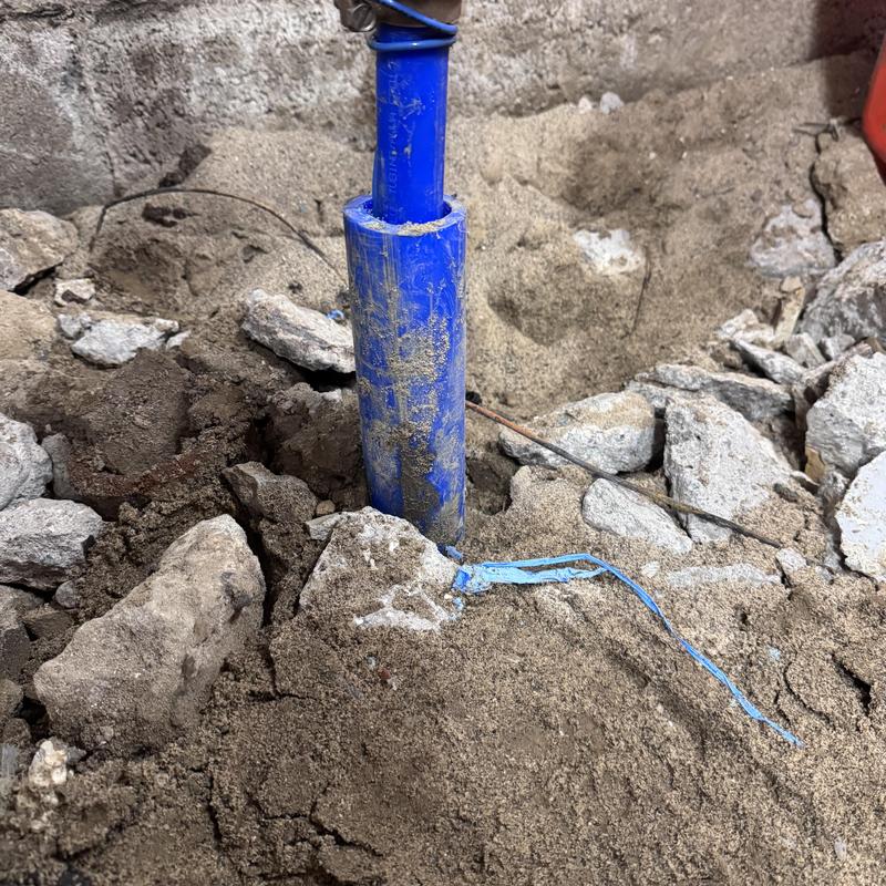 Poly water service line reroute amid broken concrete