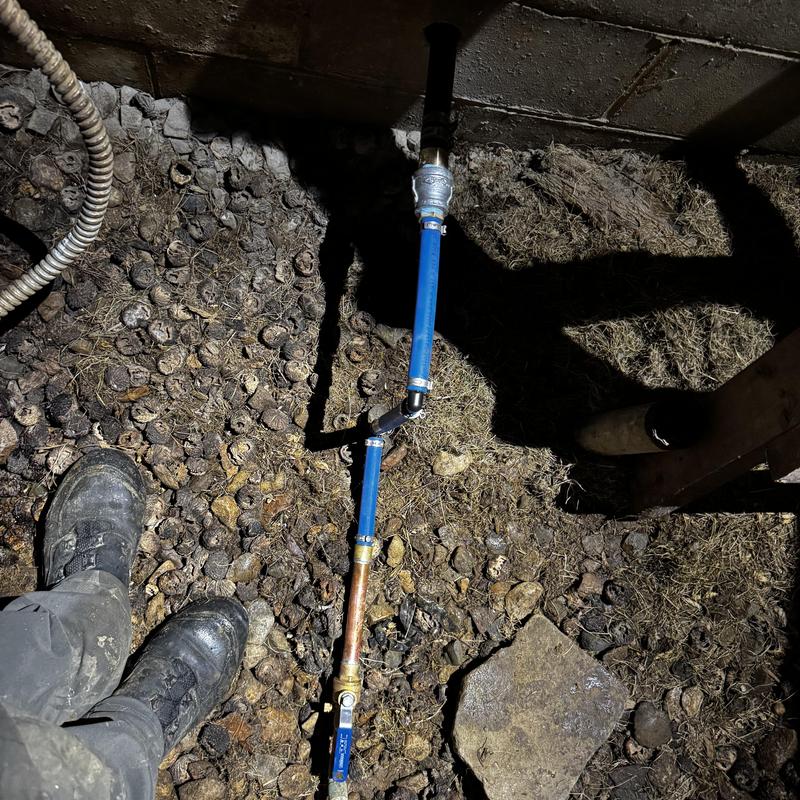 Water line replacement with blue poly pipe in pit