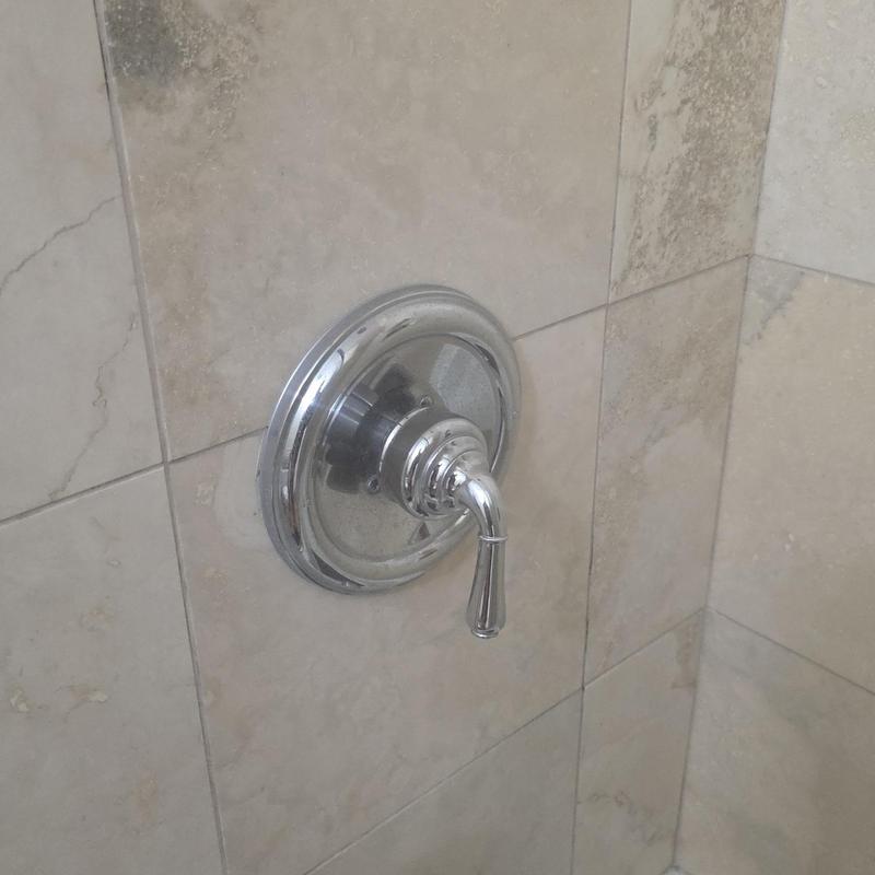 Shower valve handle on tiled wall installation