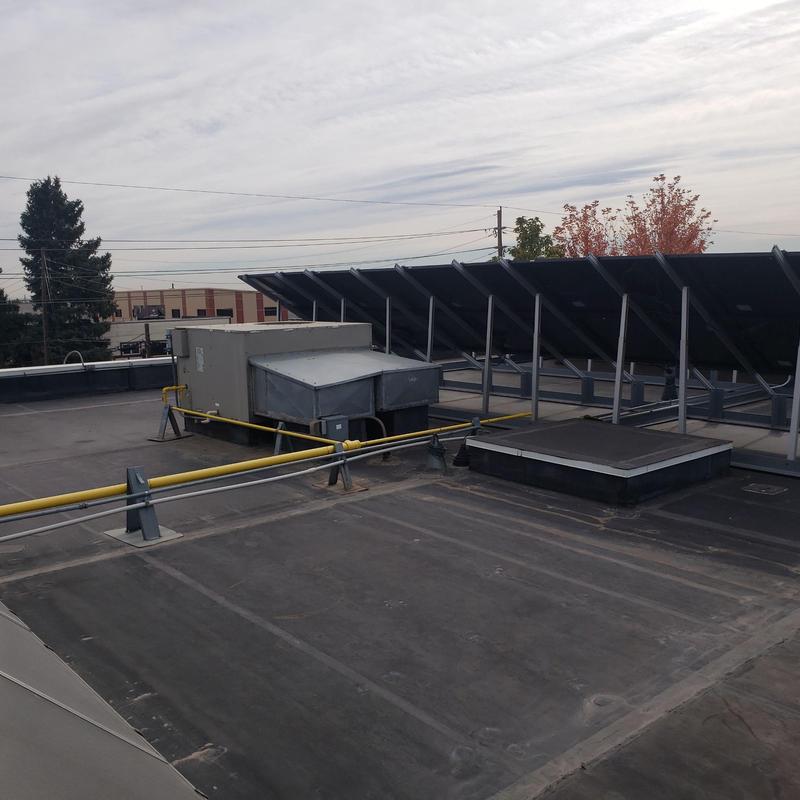 EPDM flat roof near solar panels with HVAC unit EPDM flat roof near solar panels with HVAC unit
