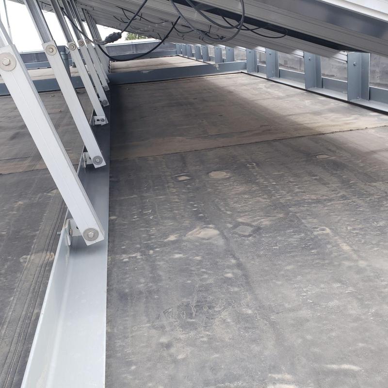 EPDM flat roof under solar panel mounts with damage EPDM flat roof under solar panel mounts with damage