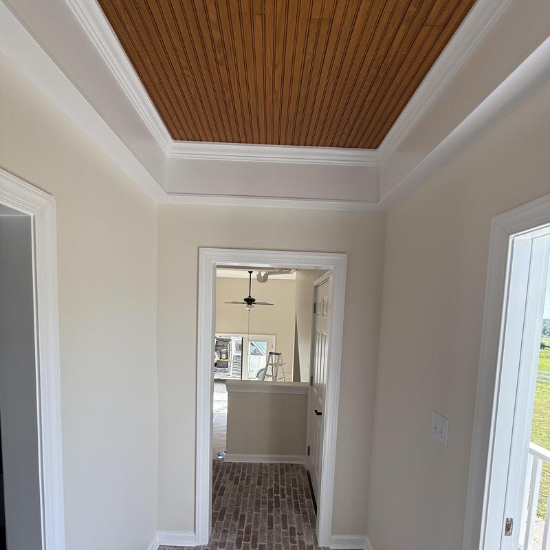 Wood plank ceiling with crown molding in hallway Wood plank ceiling with crown molding in hallway
