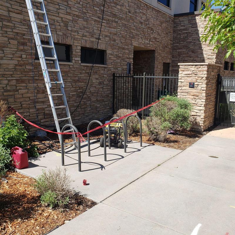 Flat roof drain area with ladder and caution tape Flat roof drain area with ladder and caution tape