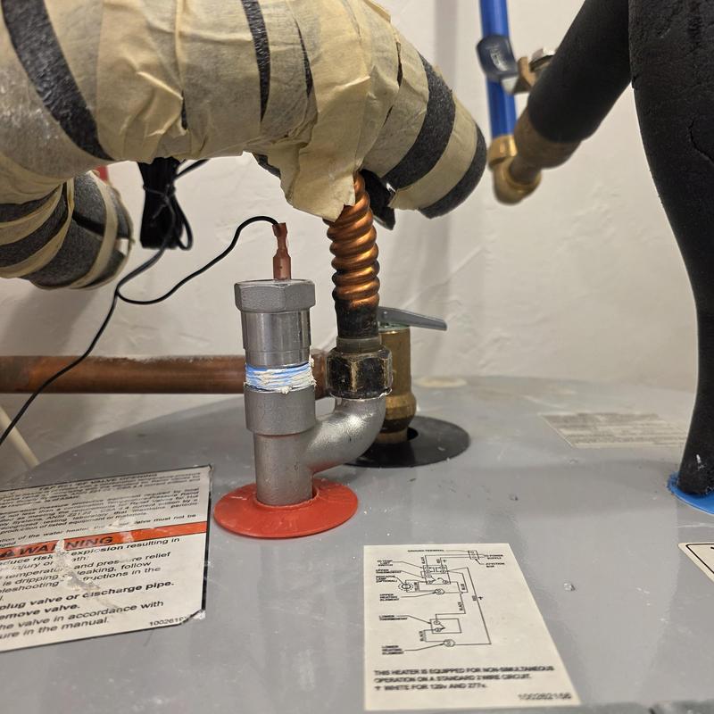 Electric water heater with installed anode rod