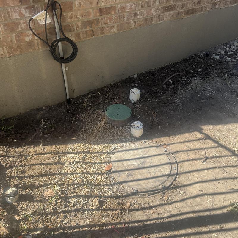 Grinder pump system with new water shut off valve