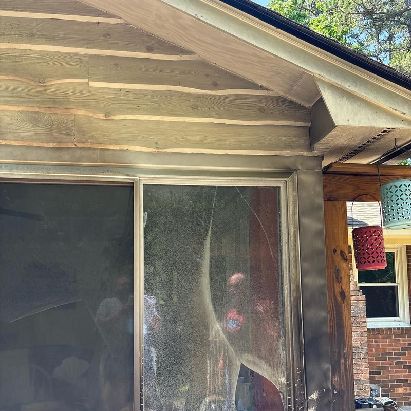 Screen door with fire and heat damage on exterior wall Screen door with fire and heat damage on exterior wall