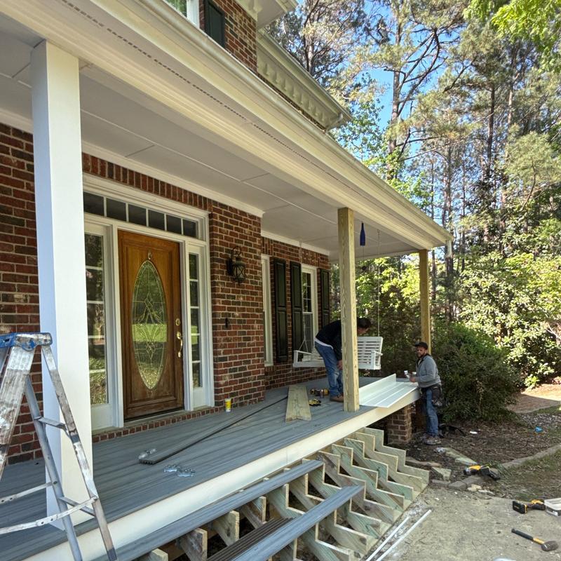 Front porch decking and railing installation in progress Front porch decking and railing installation in progress