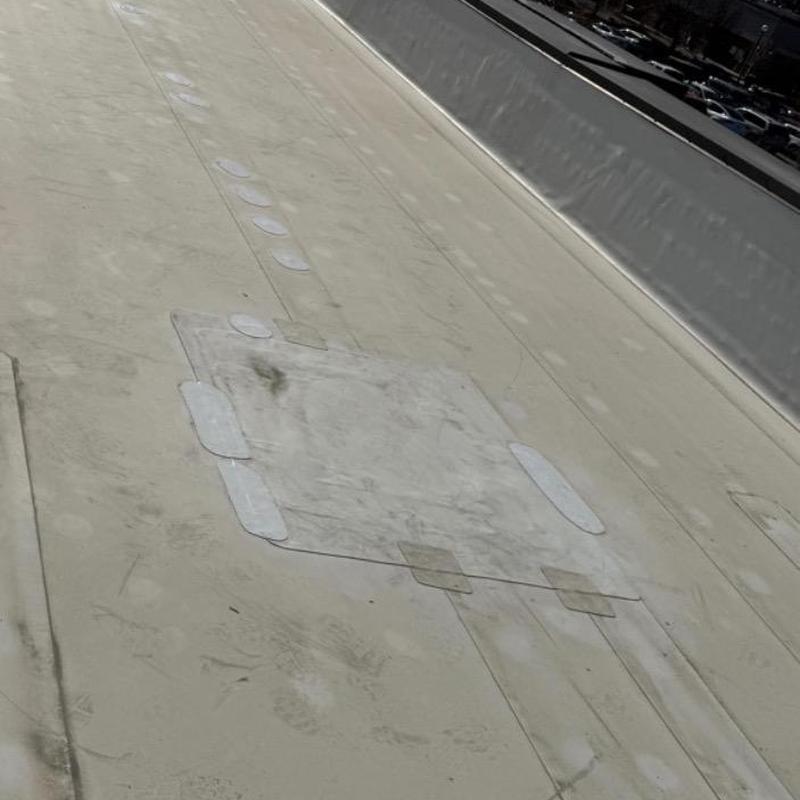 TPO roofing membrane patch on commercial roof