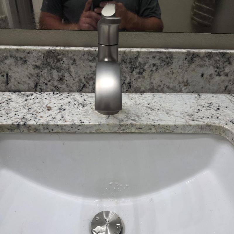 Bathroom lav faucet and sink with granite countertop