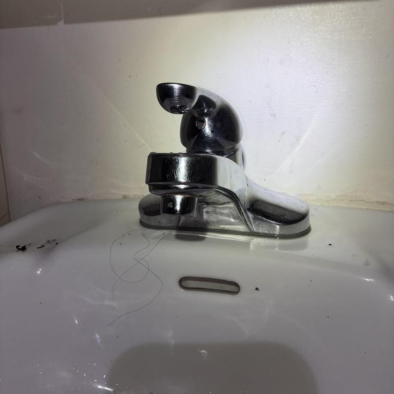 Delta basin faucet with repaired seats and springs