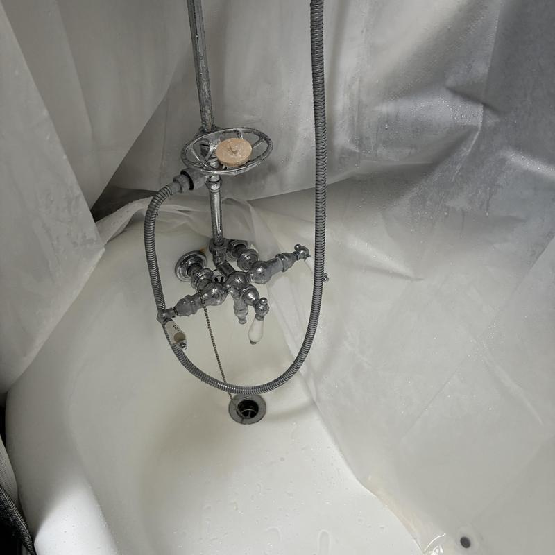 Shower faucet diverter with hose in bathtub