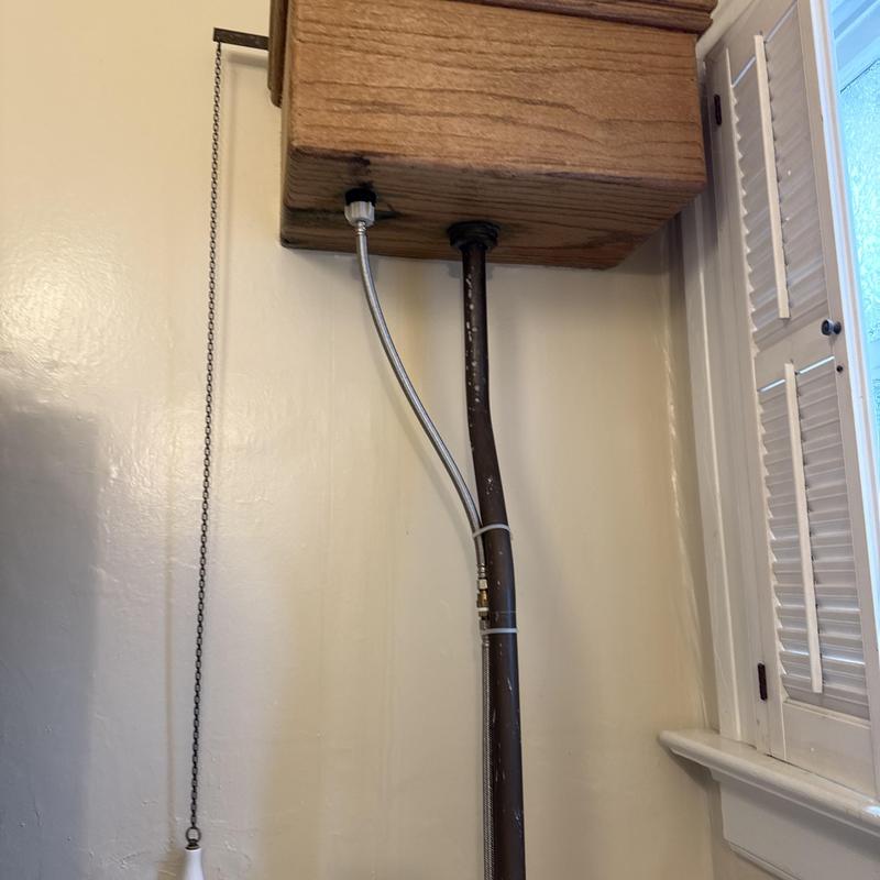 Toilet fill valve and water supply lines in wooden tank