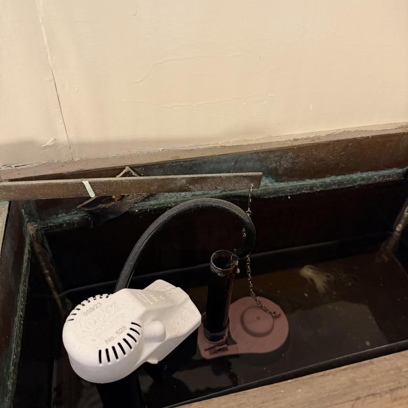 Toilet fill valve and flapper inside tank