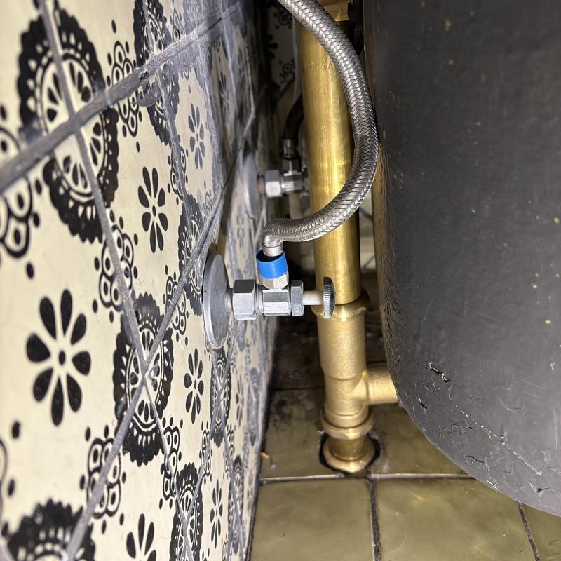 Tub waste and overflow replacement near tiled wall
