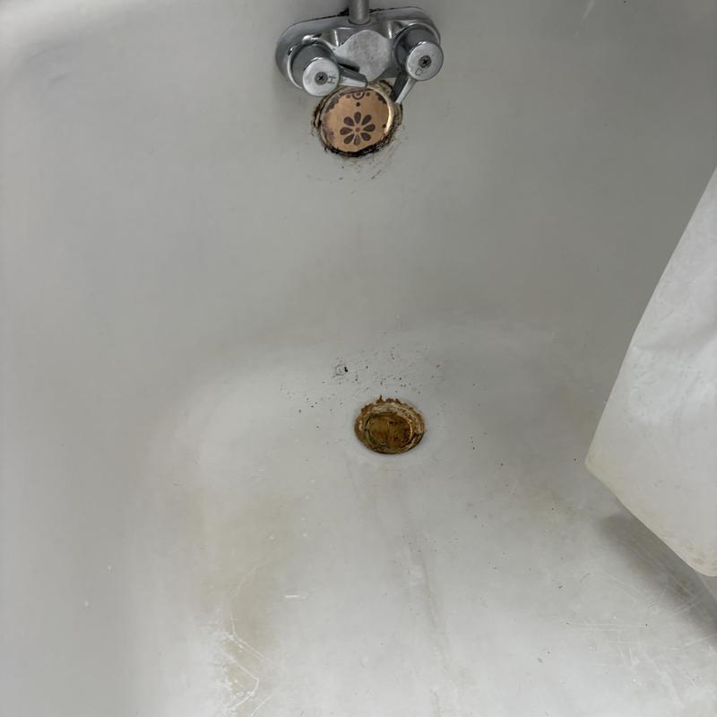 Tub drain and overflow holes in bathtub without fixtures