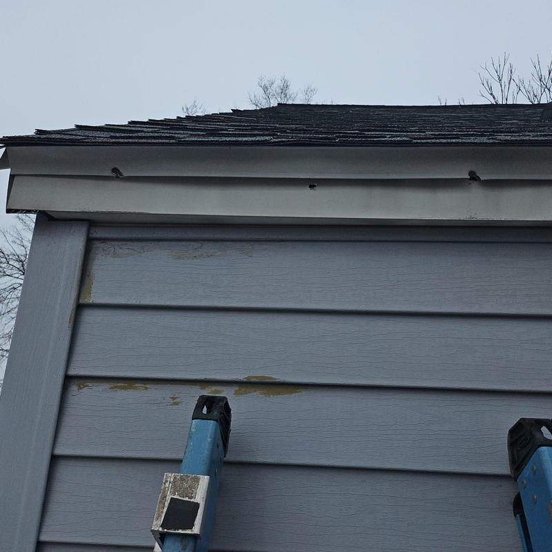 Fascia metal displaced near roof edge by ice damage Fascia metal displaced near roof edge by ice damage